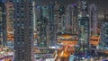 Aerial view on Dubai Marina skyscrapers and the most luxury yacht in harbor night timelapse, Dubai, United Arab Emirates Royalty Free Stock Photo