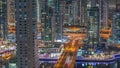 Aerial view on Dubai Marina skyscrapers and the most luxury yacht in harbor night timelapse, Dubai, United Arab Emirates Royalty Free Stock Photo