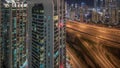 Aerial view of Dubai marina and JLT skyscrapers with glowing windows night timelapse with traffic on sheikh zayed road. Royalty Free Stock Photo