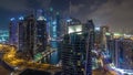 Aerial view of Dubai Marina residential and office skyscrapers with waterfront night timelapse hyperlapse Royalty Free Stock Photo