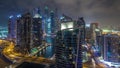 Aerial view of Dubai Marina residential and office skyscrapers with waterfront night timelapse hyperlapse Royalty Free Stock Photo