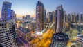 Aerial view of Dubai Marina after sunset from a vantage point day to night timelapse. Royalty Free Stock Photo