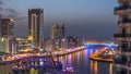 An Aerial view of Dubai Marina Towers in Dubai day to night timelapse Royalty Free Stock Photo