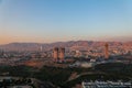 Aerial view of the Duhok city with its skyscrapers and twin towers in the middle at sunset light