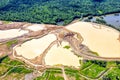 Aerial view of dumps and polluted ponds. Gold mining. Problem of environmental pollution
