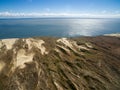 Aerial view with dunes, forest and sea in Curonian spit on a sunny day photographed with a drone. Royalty Free Stock Photo