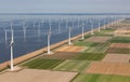 Aerial view Dutch landscape with offshore wind turbines along coast