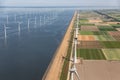 Aerial view Dutch landscape with offshore wind turbines along coast Royalty Free Stock Photo