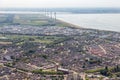 Aerial view Dutch fishing village with residential area and windturbines