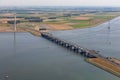 Aerial view Dutch landscape with bridge and wind turbines