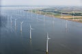 Aerial view Dutch sea with offshore wind turbines along coast