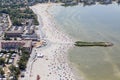 Aerial view Dutch village Makkum with beach and swimming people