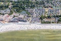 Aerial view Dutch village Makkum with beach and swimming people