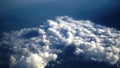 Aerial view of the earth cover by clouds. Background of blue sky with cloud and the ocean scenery from the airplane.