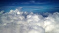 Aerial view of the earth cover by clouds. Background of blue sky with cloud and the ocean scenery from the airplane. Natural