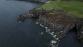 Aerial view of the edge of misty island in Japan. Clip. Autumn rocky sea shore. Royalty Free Stock Photo