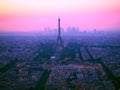 Aerial view of Eiffel tower, La Defense and the rooftops of Paris during a gorgeous sunset, France