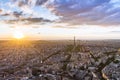 Drone aerial view of Paris, Eiffel Tower, historical city center and La Defense at sunset in summer