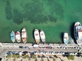 Aerial view of Elounda Bay on the Greek island of Crete with a fleet of boats parked in the harbor