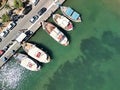 Aerial view of Elounda Bay on the Greek island of Crete with a fleet of boats parked in the harbor