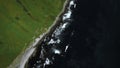 Aerial view of the emerald green field and blue sea of Japan. Clip. Summer seascape with blue cloudy sky. Royalty Free Stock Photo