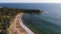 Aerial view of an emerald green sea and big foaming waves. Indian Ocean. Dikwella beach. Sri Lanka