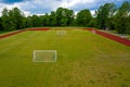 Aerial view of empty green football field and red running tracks Royalty Free Stock Photo
