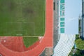 Aerial view of empty green football field with running track Empty stadium view from top Royalty Free Stock Photo