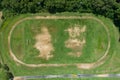 Aerial view of empty green football field with running track Empty stadium view from top Royalty Free Stock Photo