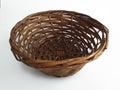 Aerial view of empty handmade wicker oval basket isolated on white background