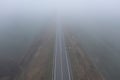 Aerial view of a empty highway passing through agricultural fields Royalty Free Stock Photo