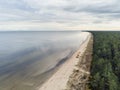 Aerial view on empty Jurmala beach, Cloudy sky, Green forest, nobody. Latvia