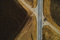 Aerial view of empty road through countryside landscape Royalty Free Stock Photo