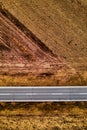Aerial view of empty road through countryside landscape Royalty Free Stock Photo
