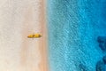 Aerial view of empty sandy beach with yellow canoe Royalty Free Stock Photo