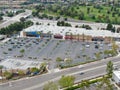 Aerial view of empty shopping center parking lot during COVID-19 pandemic.