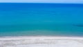 Aerial view of empty tropic sand beach and blue sea