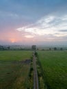 Aerial View of Enchanting Summer Landscape: Foggy Country Road at Sunrise Royalty Free Stock Photo