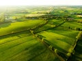 Aerial view of endless lush pastures and farmlands of Ireland. Beautiful Irish countryside with emerald green fields and meadows. Royalty Free Stock Photo