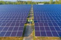 Aerial view of engineer or worker, people, with solar panels or solar cells on the roof in farm. Power plant with green field, Royalty Free Stock Photo