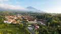 Aerial view of Enjoy the morning with the expanse of rice fields and views of Mount Ciremai. Kuningan, West Java, Indonesia, July