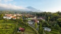 Aerial view of Enjoy the morning with the expanse of rice fields and views of Mount Ciremai. Kuningan, West Java, Indonesia, July