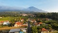 Aerial view of Enjoy the morning with the expanse of rice fields and views of Mount Ciremai. Kuningan, West Java, Indonesia, July