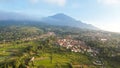 Aerial view of Enjoy the morning with the expanse of rice fields and views of Mount Ciremai. Kuningan, West Java, Indonesia, July Royalty Free Stock Photo
