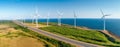 aerial view of Environmentally friendly installation of photovoltaic power plant and wind turbine farm situated by Royalty Free Stock Photo