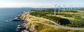 aerial view of Environmentally friendly installation of photovoltaic power plant and wind turbine farm situated by Royalty Free Stock Photo