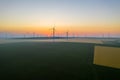 Aerial view of Eolian generators in a beautiful wheat field. Eolian turbine farm. Wind turbine silhouette. Wind mill turbines. Win Royalty Free Stock Photo
