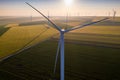 Aerial view of Eolian generators in a beautiful wheat field. Eolian turbine farm. Wind turbine silhouette. Wind mill turbines. Win Royalty Free Stock Photo