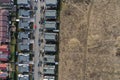 Aerial view of European real estate neighborhood, residential area surrounded by meadow. Housing subdivision, development, sale, Royalty Free Stock Photo