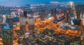 Aerial View Of Evening Night Scenic View Of Skyscraper In Dubai. Street Night Traffic In Dudai Skyline. Waterfront And Royalty Free Stock Photo